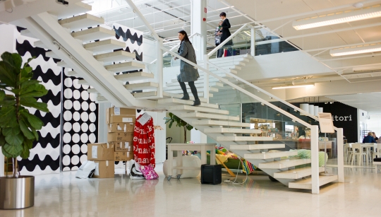 A grand stair in the entrance acts as a collection point for chance encounters as people come and go.
